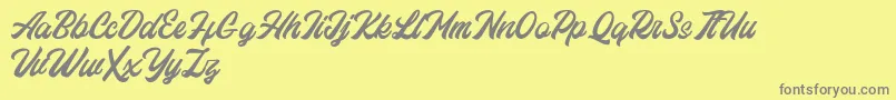 Eastchaft FREE-Schriftart – Graue Schriften auf gelbem Hintergrund
