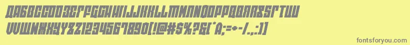 eastwestexpandital-fontti – harmaat kirjasimet keltaisella taustalla