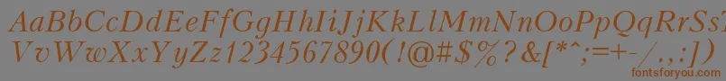フォントPeterburgItalic – 茶色の文字が灰色の背景にあります。