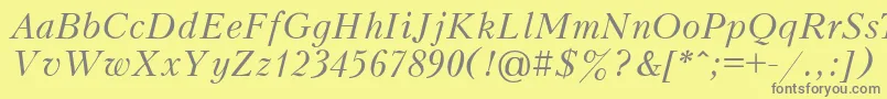 Fonte PeterburgItalic – fontes cinzas em um fundo amarelo