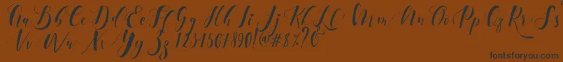 フォントEctomorph Dafont – 黒い文字が茶色の背景にあります