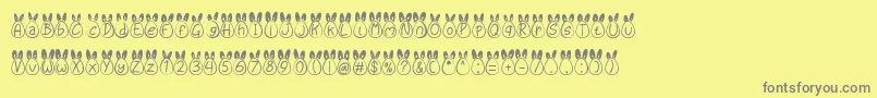 Eggy Bunny Ear-Schriftart – Graue Schriften auf gelbem Hintergrund