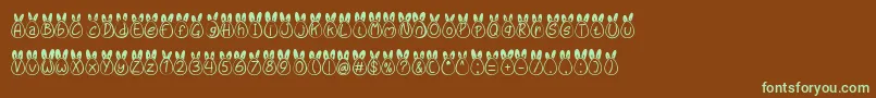 フォントEggy Bunny Ear – 緑色の文字が茶色の背景にあります。