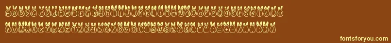 Шрифт Eggy Bunny Ear – жёлтые шрифты на коричневом фоне