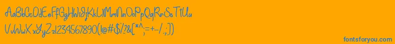 Einhorn Schrift  -Schriftart – Blaue Schriften auf orangefarbenem Hintergrund