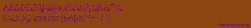 Einhorn Schrift  -Schriftart – Violette Schriften auf braunem Hintergrund