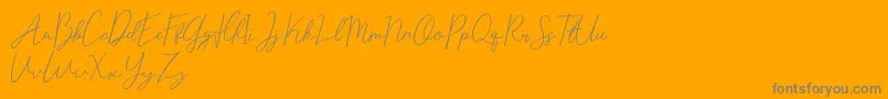 Eisley Claise Free-Schriftart – Graue Schriften auf orangefarbenem Hintergrund