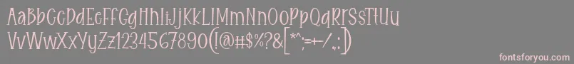 Eitaro Font by 7NTypes-fontti – vaaleanpunaiset fontit harmaalla taustalla