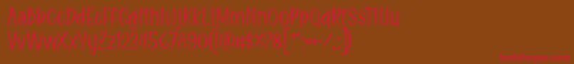 Eitaro Font by 7NTypes-Schriftart – Rote Schriften auf braunem Hintergrund