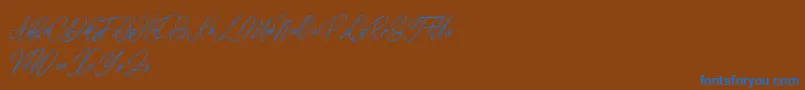 elaineighteen-Schriftart – Blaue Schriften auf braunem Hintergrund