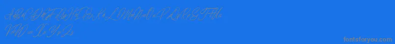 elaineighteen-Schriftart – Graue Schriften auf blauem Hintergrund