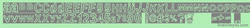 electric Punk-Schriftart – Graue Schriften auf grünem Hintergrund