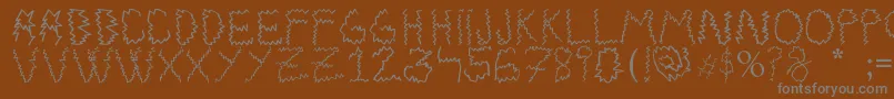 Electrica Salsa-fontti – harmaat kirjasimet ruskealla taustalla