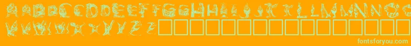 Elfabet  Decorative-Schriftart – Grüne Schriften auf orangefarbenem Hintergrund