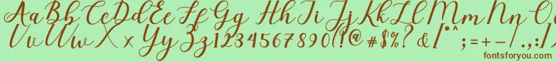 Fonte Elizabeth Script – fontes marrons em um fundo verde