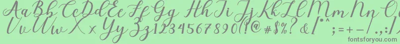 Fonte Elizabeth Script – fontes cinzas em um fundo verde