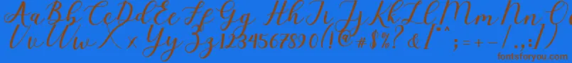 Fonte Elizabeth Script – fontes marrons em um fundo azul