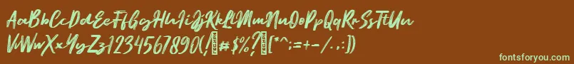 フォントEmatodas Demo – 緑色の文字が茶色の背景にあります。