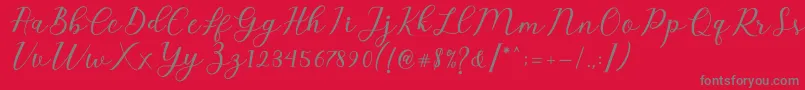 Emeley Script Font – Gray Fonts on Red Background