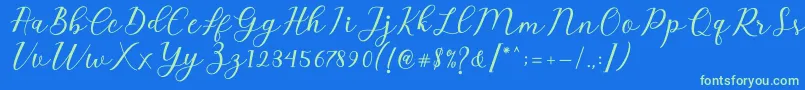 Czcionka Emeley Script – zielone czcionki na niebieskim tle