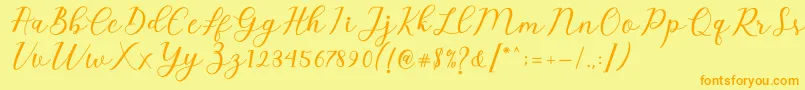 Emeley Script Font – Orange Fonts on Yellow Background