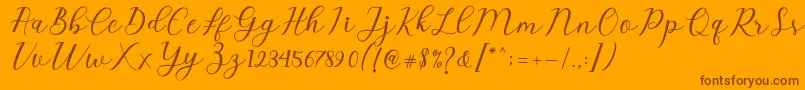 Czcionka Emeley Script – brązowe czcionki na pomarańczowym tle