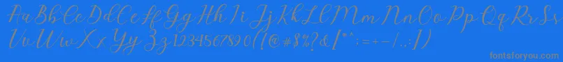 fuente Emeley Script – Fuentes Grises Sobre Fondo Azul