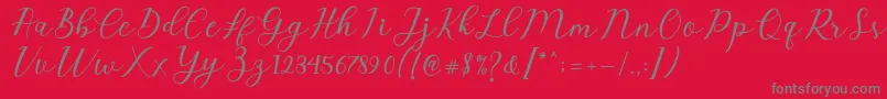 Emeley Script Font – Gray Fonts on Red Background