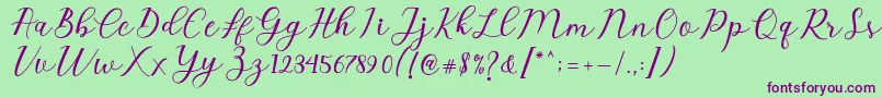 Emeley Script Font – Purple Fonts on Green Background
