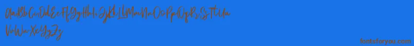 Emerisa Free-Schriftart – Braune Schriften auf blauem Hintergrund