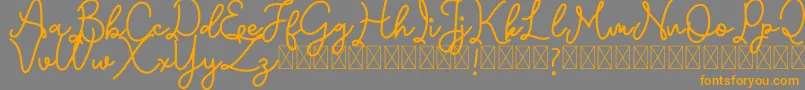 Emerttons Font – Orange Fonts on Gray Background
