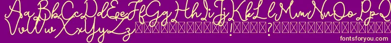 Emerttons Font – Yellow Fonts on Purple Background