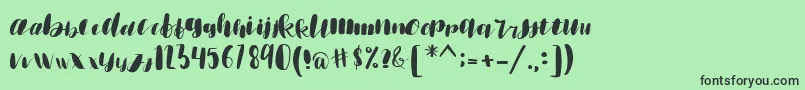 emisha Font – Black Fonts on Green Background