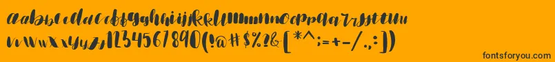 emisha Font – Black Fonts on Orange Background