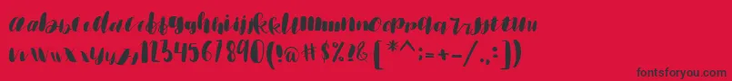 emisha Font – Black Fonts on Red Background