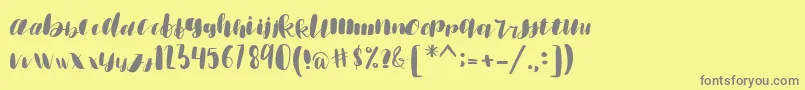emisha Font – Gray Fonts on Yellow Background