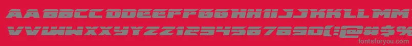 Fonte emissarylaserital – fontes cinzas em um fundo vermelho