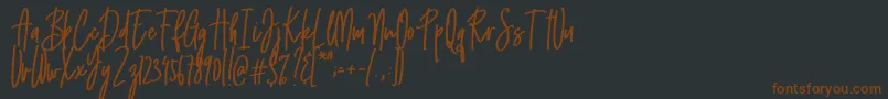 Emma signature-fontti – ruskeat fontit mustalla taustalla