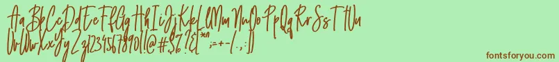 Emma signature-Schriftart – Braune Schriften auf grünem Hintergrund