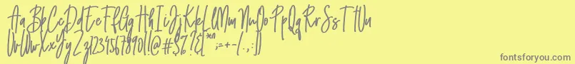 Emma signature Font – Gray Fonts on Yellow Background