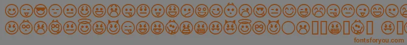 フォントemoticons – 茶色の文字が灰色の背景にあります。