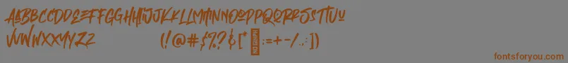 フォントEmpires – 茶色の文字が灰色の背景にあります。