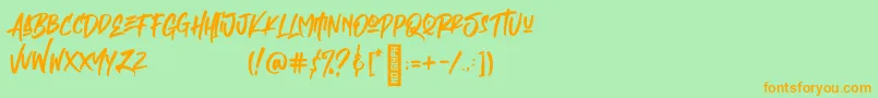 フォントEmpires – オレンジの文字が緑の背景にあります。