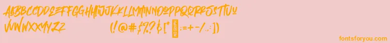 フォントEmpires – オレンジの文字がピンクの背景にあります。