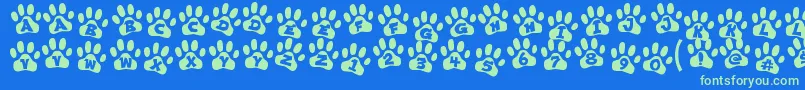 ennobled pet-Schriftart – Grüne Schriften auf blauem Hintergrund