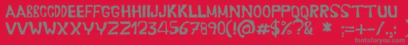 Erasaur-fontti – harmaat kirjasimet punaisella taustalla