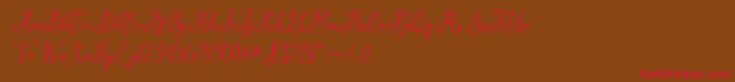 Eritta Script-Schriftart – Rote Schriften auf braunem Hintergrund