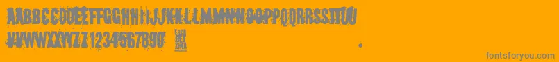 Escabetxina-Schriftart – Graue Schriften auf orangefarbenem Hintergrund