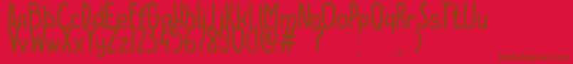 ESCAMPURENAK Font – Brown Fonts on Red Background
