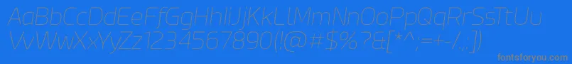 Fonte Esphimere Thin Italic – fontes cinzas em um fundo azul